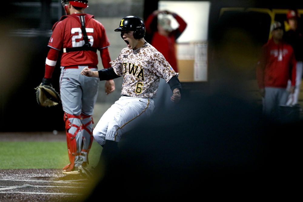 Iowa Hawkeyes outfielder Justin Jenkins (6) scores the game winning run in the bottom of the 9th against the Nebraska Cornhuskers on Military Appreciation Night Friday, April 19, 2019 at Duane Banks Field. (Brian Ray/hawkeyesports.com)