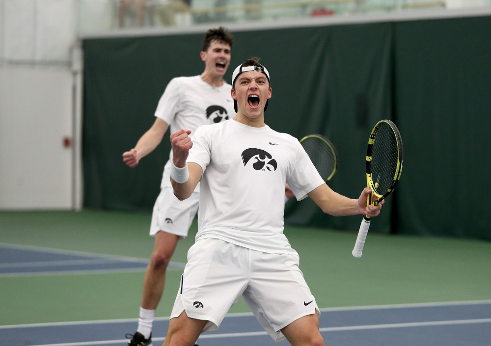 Iowa’s Joe Tyler and Matt Cleggle celebrating after winning  a doubles match against Cornell Sunday, March 8, 2020 at the Hawkeye Tennis and Recreation Center. (Brian Ray/hawkeyesports.com)