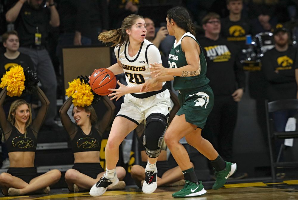 Iowa Hawkeyes guard Kate Martin (20) looks to pass during the fourth quarter of their game at Carver-Hawkeye Arena in Iowa City on Sunday, January 26, 2020. (Stephen Mally/hawkeyesports.com)