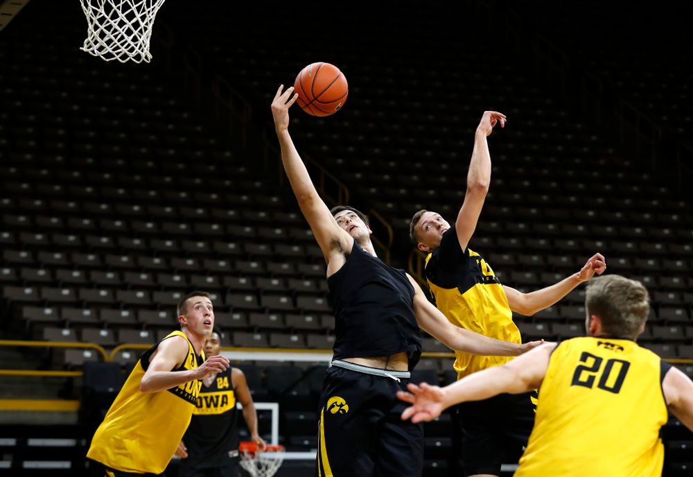 Iowa Hawkeyes forward Ryan Kriener (15) grabs a rebound during the first practice of the season Monday, October 1, 2018 at Carver-Hawkeye Arena. (Brian Ray/hawkeyesports.com)
