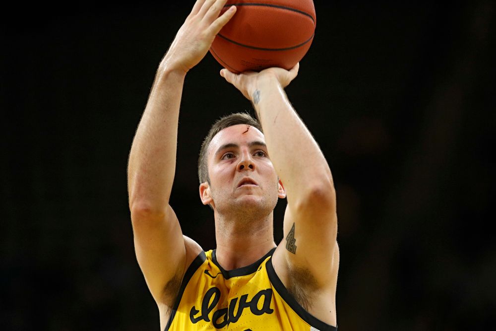 Iowa Hawkeyes guard Connor McCaffery (30) makes a free throw after getting a cut on his forehead during the first half of their game at Carver-Hawkeye Arena in Iowa City on Monday, Nov 11, 2019. (Stephen Mally/hawkeyesports.com)