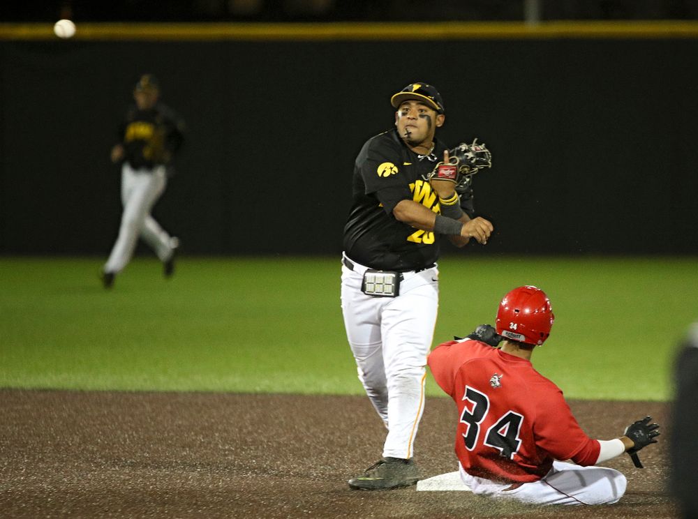 Iowa infielder Izaya Fullard (20) throws to first to complete a double play during the eighth inning of their game at Duane Banks Field in Iowa City on Tuesday, March 3, 2020. (Stephen Mally/hawkeyesports.com)