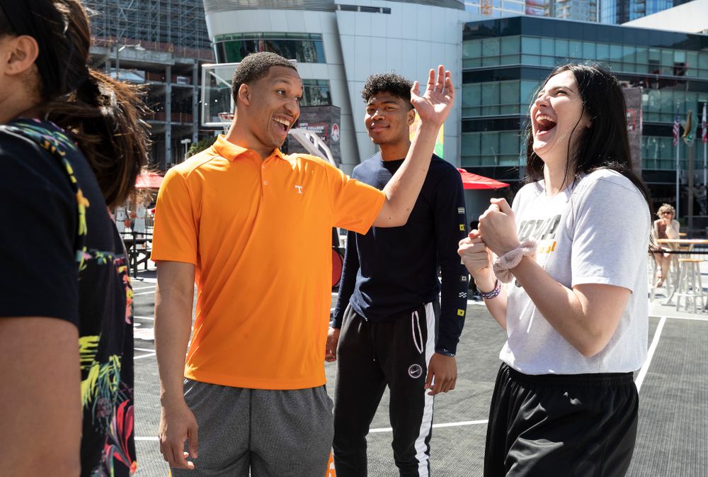Iowa Hawkeyes forward Megan Gustafson (10) laughs with TennesseeÕs Grant Williams during a Special Olympics Event Friday, April 12, 2019 in the XBOX Plaza at LA Live.  (Brian Ray/hawkeyesports.com)