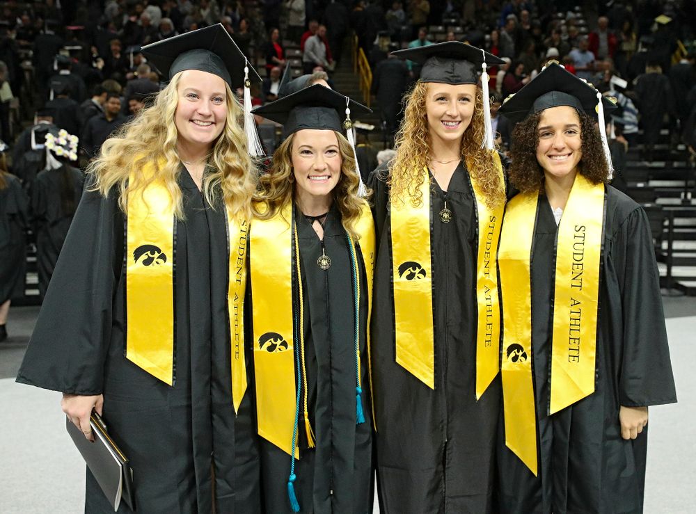 Iowa Track and Field’s Allison Wahrman (from left), Lindsay Welker, Kylie Morken, and Tia Saunders after the College of Liberal Arts and Sciences and University College Fall 2019 Commencement ceremony at Carver-Hawkeye Arena in Iowa City on Saturday, December 21, 2019. (Stephen Mally/hawkeyesports.com)
