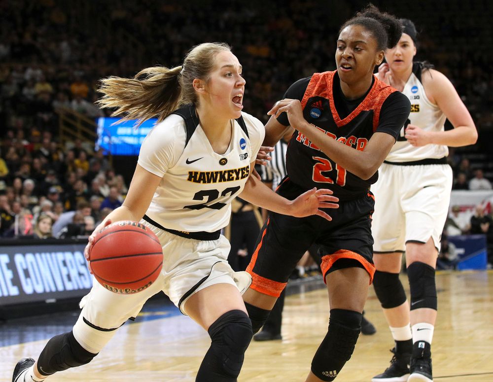 Iowa Hawkeyes guard Kathleen Doyle (22) drives around Mercer Bears guard Shannon Titus (21) during the first round of the 2019 NCAA Women's Basketball Tournament at Carver Hawkeye Arena in Iowa City on Friday, Mar. 22, 2019. (Stephen Mally for hawkeyesports.com)