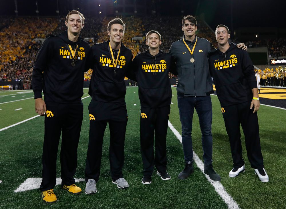 Members of the Iowa men's basketball team are recognized by the Presidential Committee on Athletics at halftime during a game against Wisconsin on September 22, 2018. (Tork Mason/hawkeyesports.com)