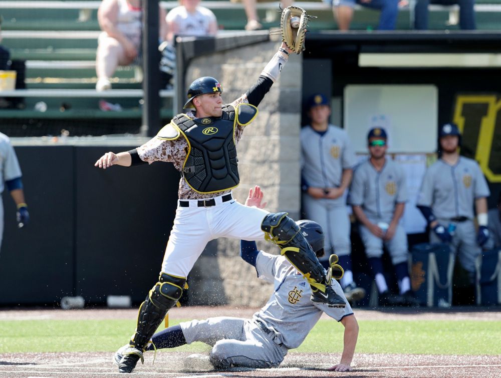 Iowa Hawkeyes catcher Austin Martin (34) pulls in a throw for a force out at home plate during the fifth inning of their game against UC Irvine at Duane Banks Field in Iowa City on Sunday, May. 5, 2019. (Stephen Mally/hawkeyesports.com)