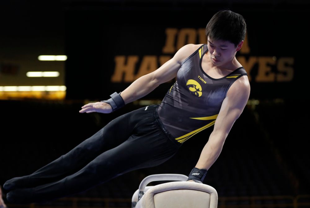 Iowa's Bennet Huang competes on the pommel horse 