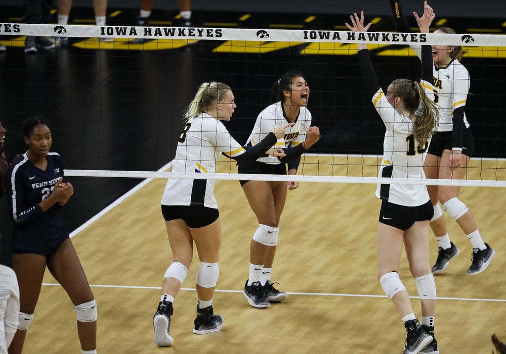 Iowa Hawkeyes right side hitter Reghan Coyle (8) and Iowa Hawkeyes setter Brie Orr (7) celebrate after winning a point during a match against Penn State at Carver-Hawkeye Arena on November 3, 2018. (Tork Mason/hawkeyesports.com)