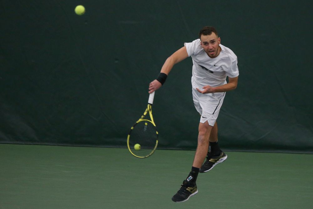 Iowa’s Kareem Allaf serves the ball during the Iowa men’s tennis meet vs Nebraska on Sunday, March 1, 2020 at the Hawkeye Tennis and Recreation Complex. (Lily Smith/hawkeyesports.com)