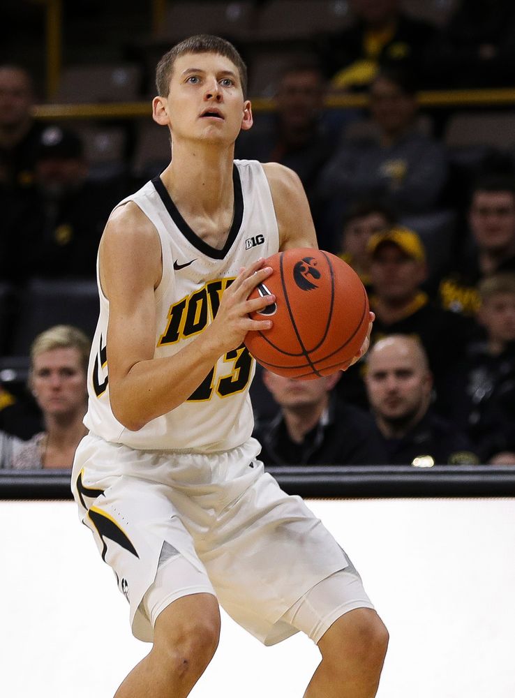 Iowa Hawkeyes guard Austin Ash (13) prepares to shoot a 3-pointer during a game against Guilford College at Carver-Hawkeye Arena on November 4, 2018. (Tork Mason/hawkeyesports.com)