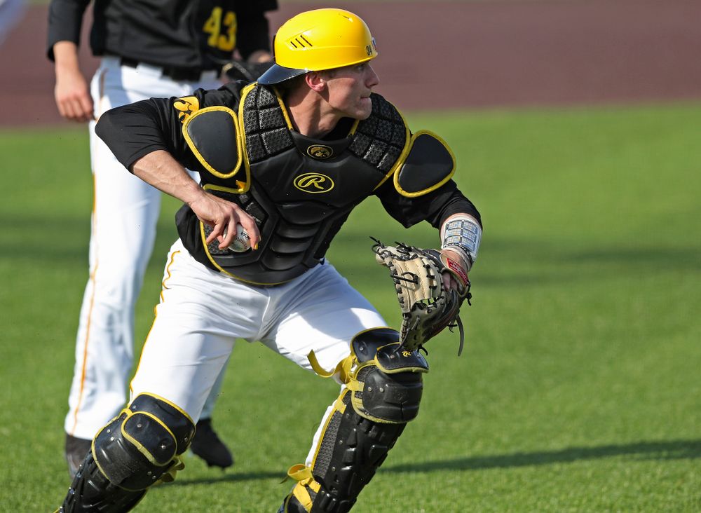 Iowa Hawkeyes catcher Austin Martin (34) throws to first for an out during the seventh inning of their game against Rutgers at Duane Banks Field in Iowa City on Saturday, Apr. 6, 2019. (Stephen Mally/hawkeyesports.com)