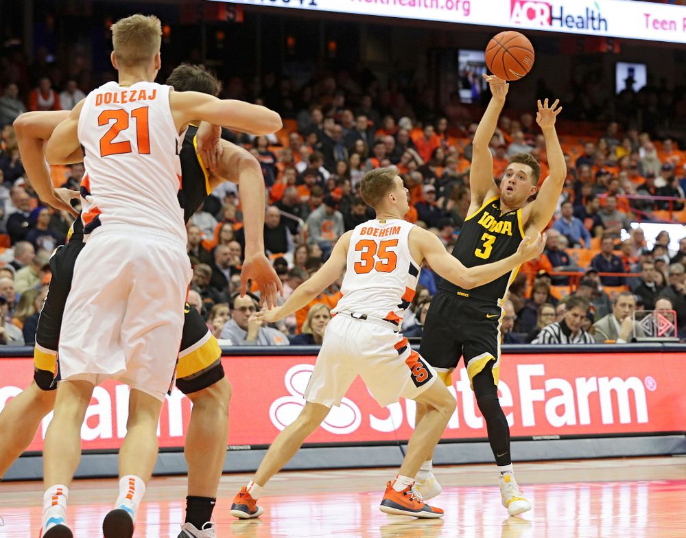 Iowa Hawkeyes guard Jordan Bohannon (3) passes the ball during the first half of their ACC/Big Ten Challenge game at the Carrier Dome in Syracuse, N.Y. on Tuesday, Dec 3, 2019. (Stephen Mally/hawkeyesports.com)
