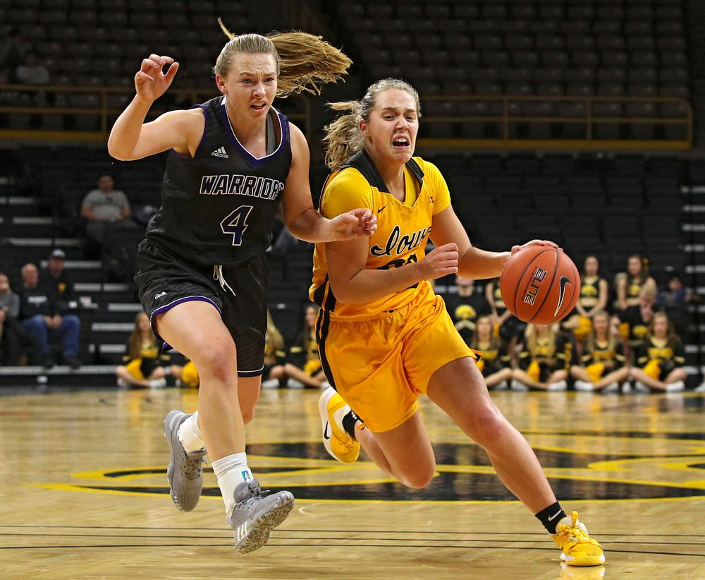 Iowa guard Kathleen Doyle (22) drives in before being fouled while making a basket during the fourth quarter of their game against Winona State at Carver-Hawkeye Arena in Iowa City on Sunday, Nov 3, 2019. (Stephen Mally/hawkeyesports.com)