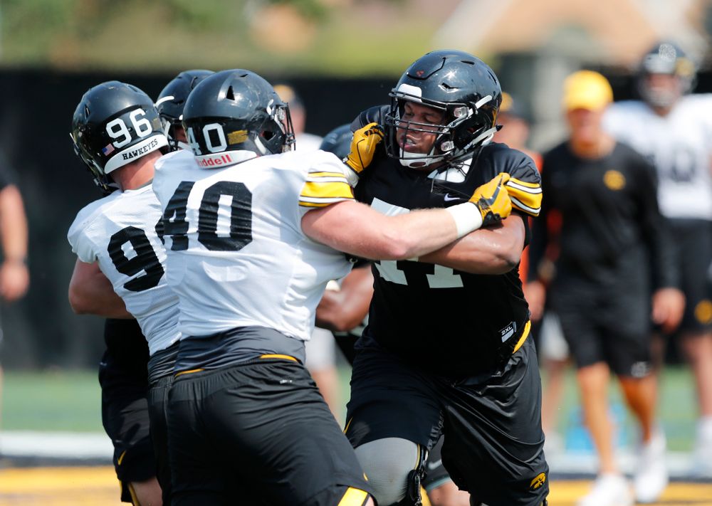 Iowa Hawkeyes offensive lineman Alaric Jackson (77) and defensive end Parker Hesse (40) during fall camp practice No. 9 Friday, August 10, 2018 at the Kenyon Practice Facility. (Brian Ray/hawkeyesports.com)