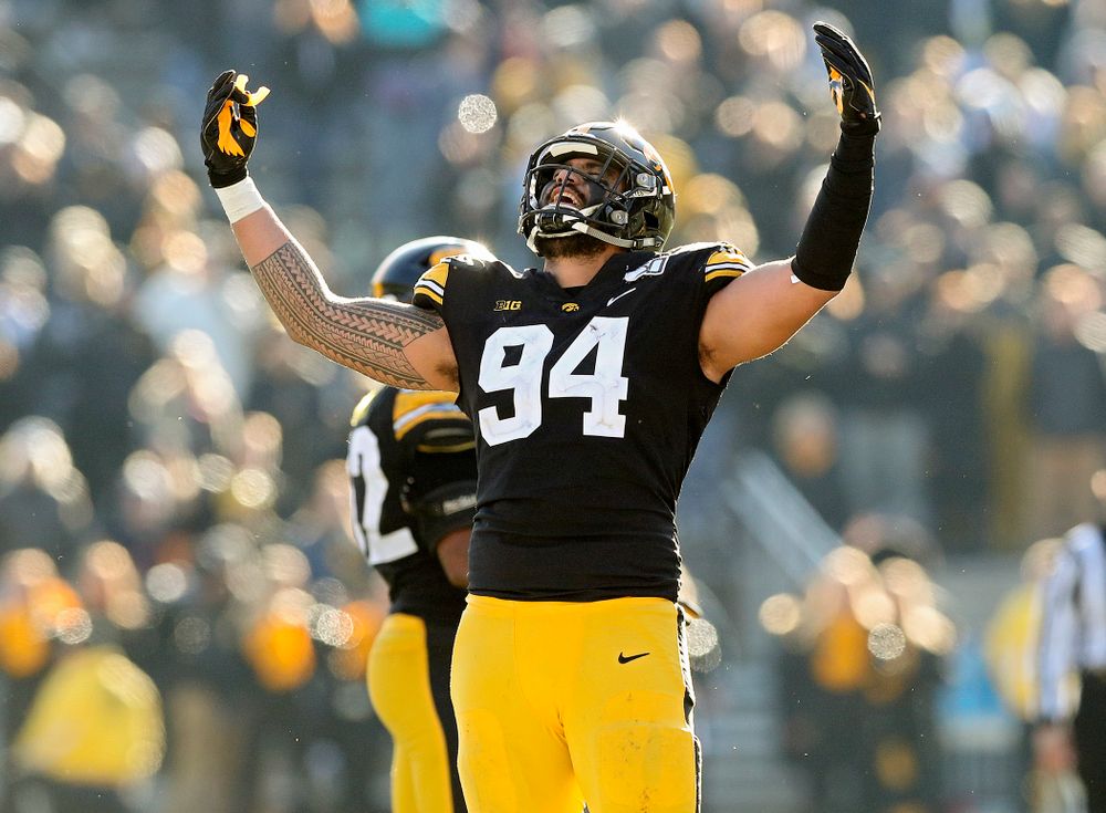 Iowa Hawkeyes defensive end A.J. Epenesa (94) pumps up the crowd during the fourth quarter of their game at Kinnick Stadium in Iowa City on Saturday, Nov 23, 2019. (Stephen Mally/hawkeyesports.com)