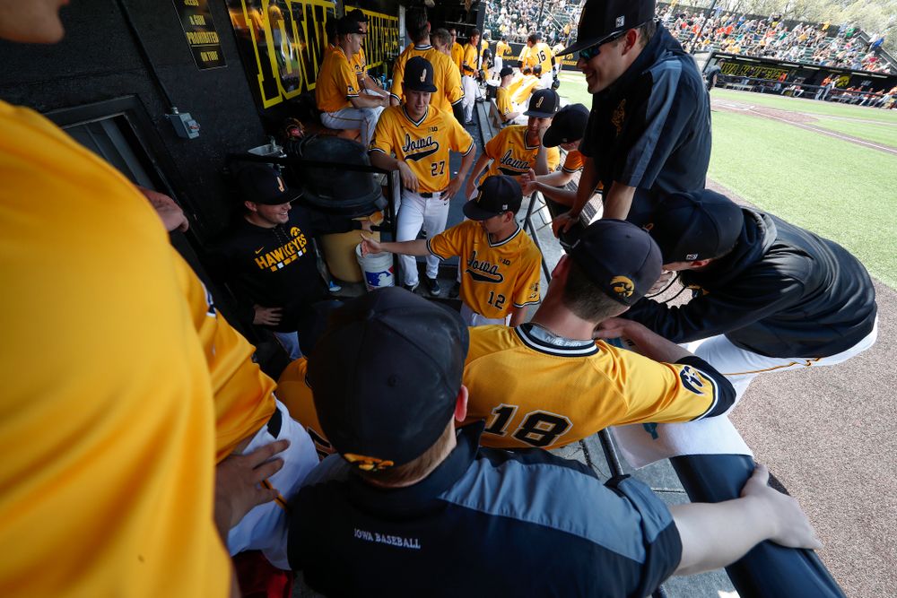 Iowa Hawkeyes pitcher Cole McDonald (11) and pitcher Nick Nelsen (12) give the scouting report on the Oklahoma State Cowboys relief pitcher Sunday, May 6, 2018 at Duane Banks Field. (Brian Ray/hawkeyesports.com)