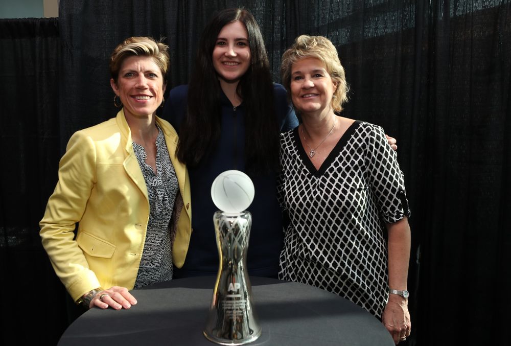 Iowa Hawkeyes forward Megan Gustafson (10) poses for  photo with Iowa Hawkeyes head coach Lisa Bluder and associate head coach Jan Jensen after winning the Associated Press Player Of The Year during a news conference Thursday, April 4, 2019 at Amalie Arena in Tampa, FL. (Brian Ray/hawkeyesports.com)