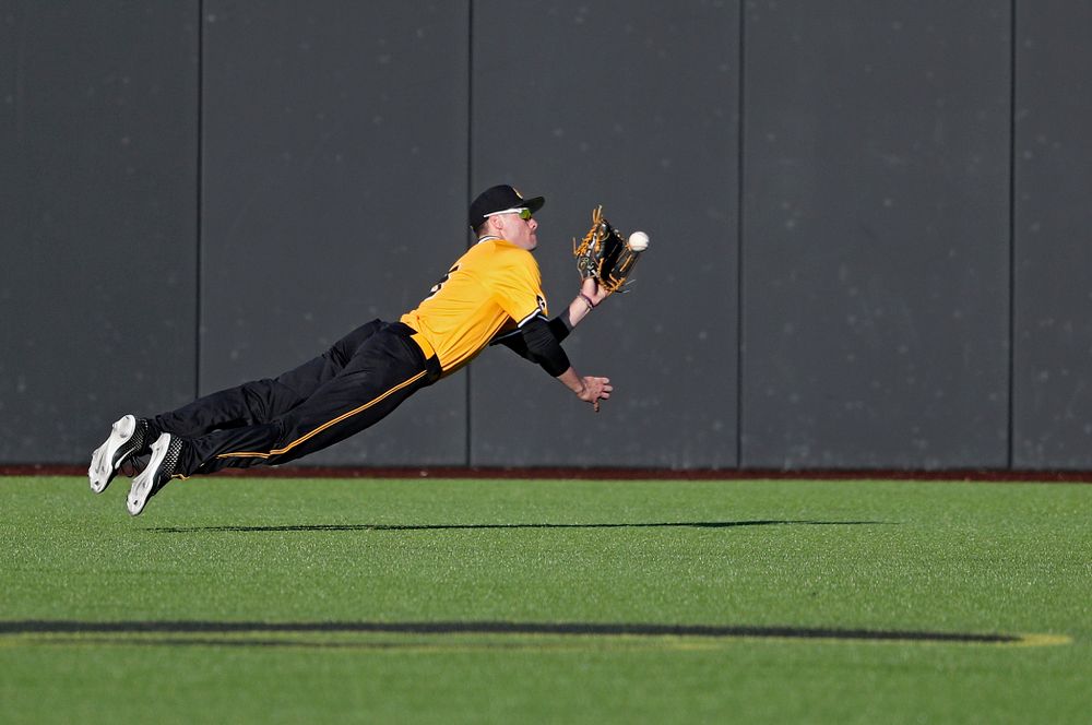 Iowa Hawkeyes center fielder Ben Norman (9) dives for the ball during the seventh inning of their game at Duane Banks Field in Iowa City on Tuesday, Apr. 2, 2019. (Stephen Mally/hawkeyesports.com)