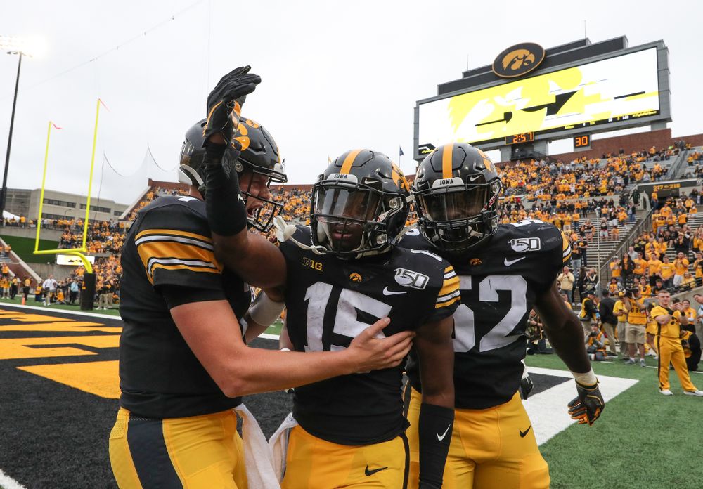 Iowa Hawkeyes quarterback Spencer Petras (7), running back Tyler Goodson (15), and linebacker Amani Jones (52) against Middle Tennessee State Saturday, September 28, 2019 at Kinnick Stadium. (Brian Ray/hawkeyesports.com)