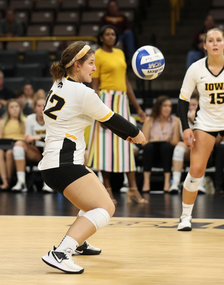Iowa Hawkeyes defensive specialist Emily Bushman (12) against the Minnesota Golden Gophers Wednesday, October 2, 2019 at Carver-Hawkeye Arena. (Brian Ray/hawkeyesports.com)