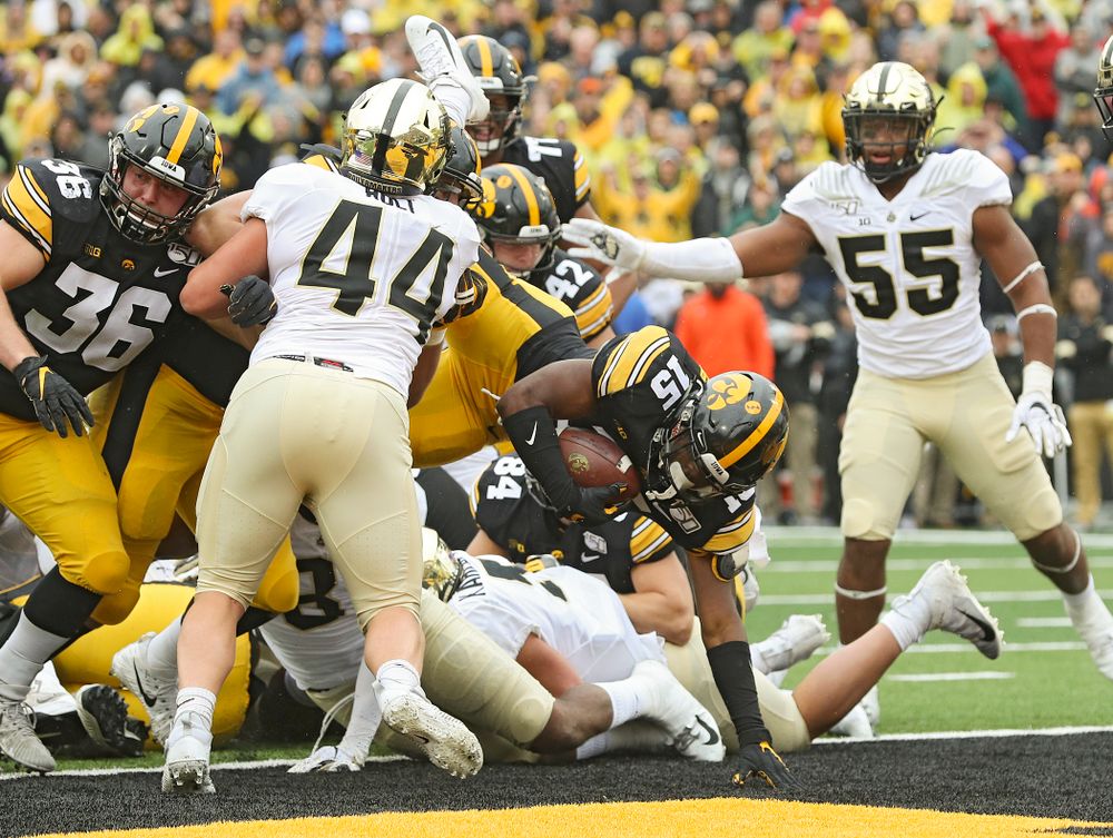 Iowa Hawkeyes running back Tyler Goodson (15) scores a touchdown during the third quarter of their game at Kinnick Stadium in Iowa City on Saturday, Oct 19, 2019. (Stephen Mally/hawkeyesports.com)