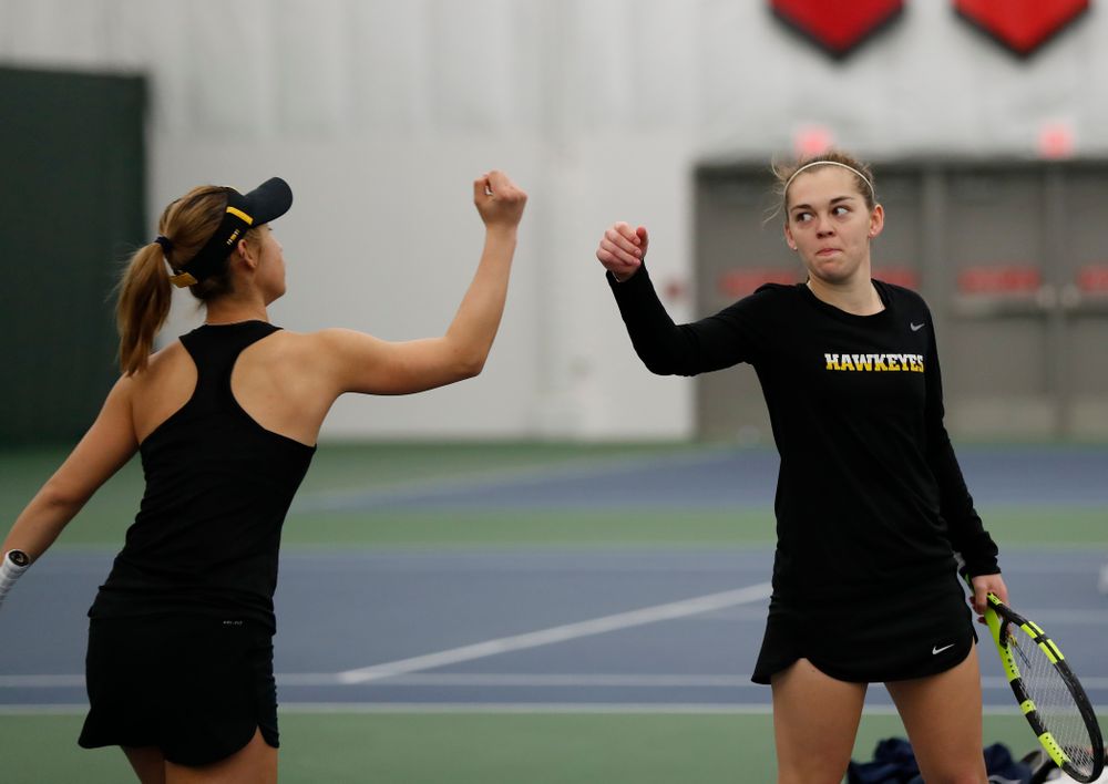 Iowa's Yufei Long and Zoe Douglas play a doubles match against Marquette 