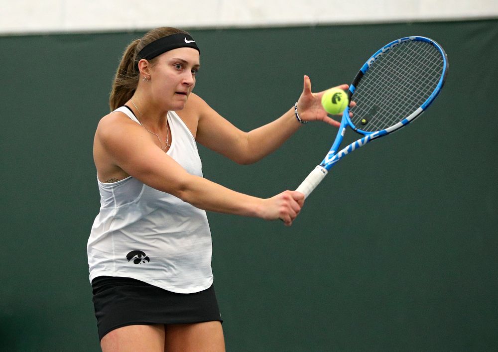 Iowa’s Ashleigh Jacobs returns a shot during her doubles match at the Hawkeye Tennis and Recreation Complex in Iowa City on Sunday, February 23, 2020. (Stephen Mally/hawkeyesports.com)