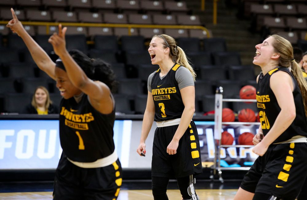 Iowa Hawkeyes guard Tomi Taiwo (1), guard Makenzie Meyer (3), and guard Kate Martin (20) celebrate at a practice during the 2019 NCAA Women's Basketball Tournament at Carver Hawkeye Arena in Iowa City on Saturday, Mar. 23, 2019. (Stephen Mally for hawkeyesports.com)