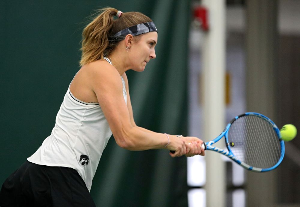 Iowa’s Ashleigh Jacobs returns a shot during her singles match at the Hawkeye Tennis and Recreation Complex in Iowa City on Sunday, February 16, 2020. (Stephen Mally/hawkeyesports.com)