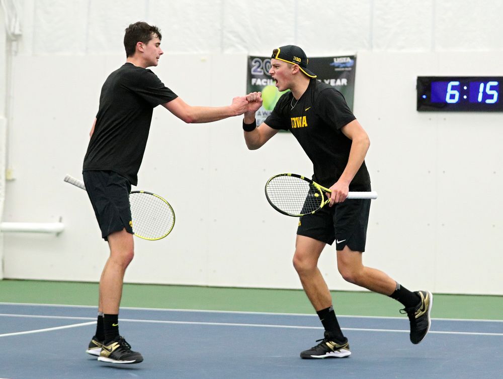 Iowa’s Matt Clegg (from left) and Joe Tyler celebrate a point during their doubles match at the Hawkeye Tennis and Recreation Complex in Iowa City on Friday, February 14, 2020. (Stephen Mally/hawkeyesports.com)
