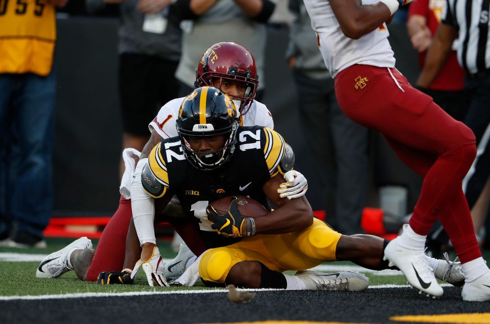 Iowa Hawkeyes wide receiver Brandon Smith (12) picks up a first down against the Iowa State Cyclones Saturday, September 8, 2018 at Kinnick Stadium. (Brian Ray/hawkeyesports.com)