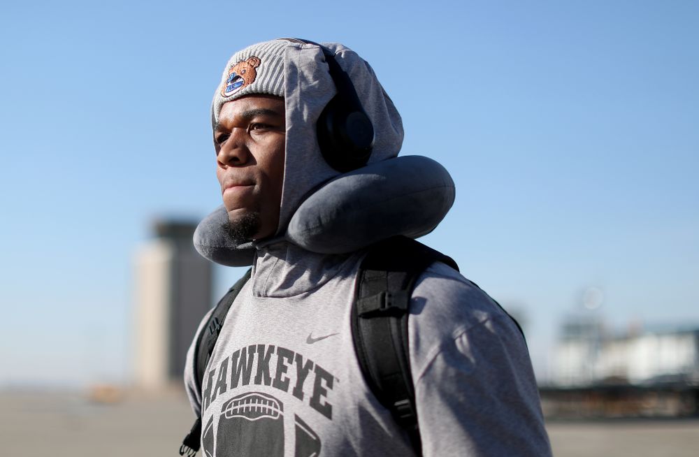 Iowa Hawkeyes defensive end Chauncey Golston (57) boards the team plane at the Eastern Iowa Airport Saturday, December 21, 2019 on the way to San Diego, CA for the Holiday Bowl. (Brian Ray/hawkeyesports.com)