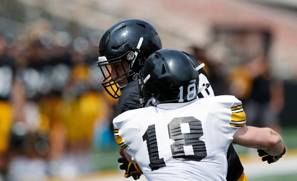Iowa Hawkeyes tight end Drew Cook (18) and defensive back John Milani (18) during Kids Day Saturday, August 11, 2018 at Kinnick Stadium. (Brian Ray/hawkeyesports.com)