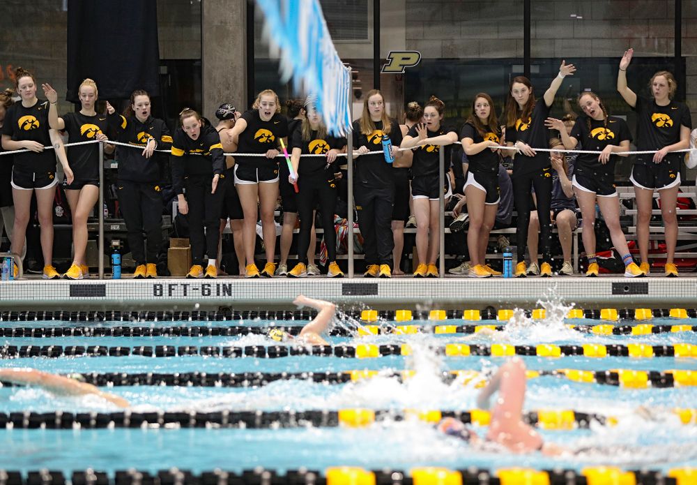 Teammates cheer on Taylor Hartley as she swims the women’s 1650 yard freestyle event during the 2020 Women’s Big Ten Swimming and Diving Championships at the Campus Recreation and Wellness Center in Iowa City on Saturday, February 22, 2020. (Stephen Mally/hawkeyesports.com)
