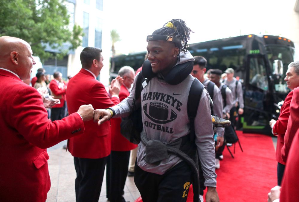 Iowa Hawkeyes wide receiver Brandon Smith (12) shakes hands with the ÒRed CoatsÓ after arriving in San Diego, CA Saturday, December 21, 2019 for the Holiday Bowl. (Brian Ray/hawkeyesports.com)