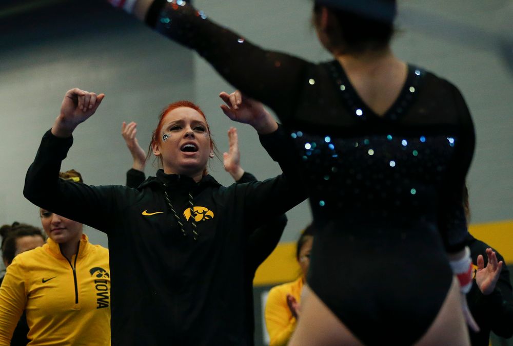 Maria Ortiz reacts after an uneven bar routine during the Black and Gold Intrasquad meet at the Field House on 12/2/17. (Tork Mason/hawkeyesports.com)