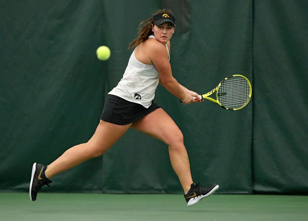Iowa’s Danielle Bauers returns a shot during her singles match at the Hawkeye Tennis and Recreation Complex in Iowa City on Sunday, February 23, 2020. (Stephen Mally/hawkeyesports.com)