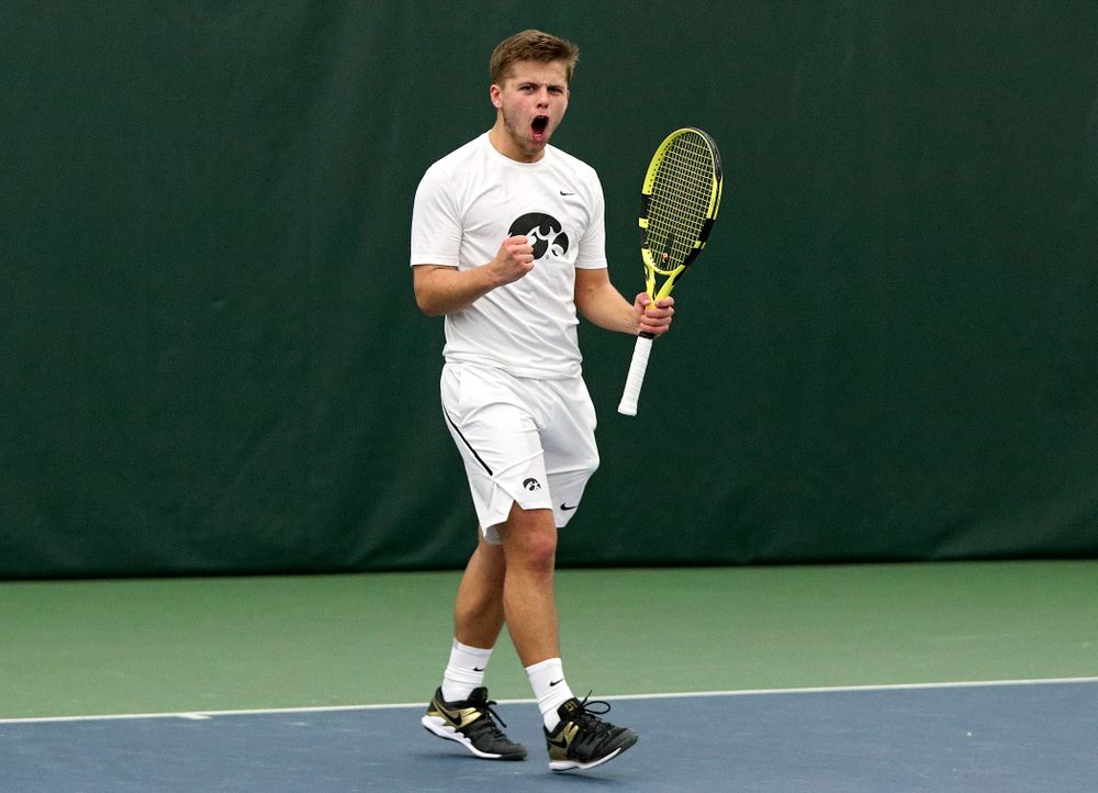 Iowa’s Will Davies celebrates after winning his singles match at the Hawkeye Tennis and Recreation Complex in Iowa City on Sunday, February 16, 2020. (Stephen Mally/hawkeyesports.com)