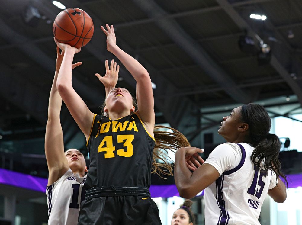 Iowa Hawkeyes forward Amanda Ollinger (43) makes a basket during the third quarter of their game at Welsh-Ryan Arena in Evanston, Ill. on Sunday, January 5, 2020. (Stephen Mally/hawkeyesports.com)