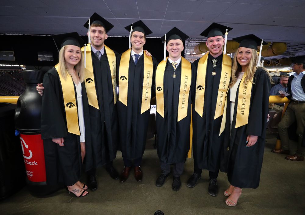 Iowa SwimmingÕs Abbe Schneider, Jack Smith Matt Kamin, Michal Brzus, Tanner Nelson, and Devin Jacobs during the College of Liberal Arts and Sciences spring commencement Saturday, May 11, 2019 at Carver-Hawkeye Arena. (Brian Ray/hawkeyesports.com)