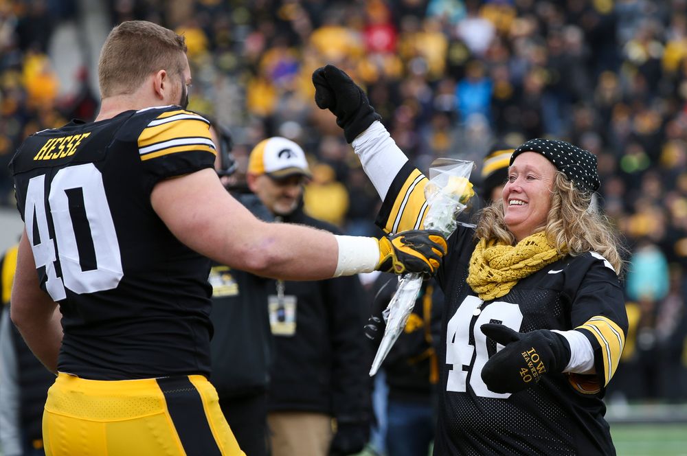 Iowa Hawkeyes defensive end Parker Hesse (40) is greeted by his parents during Senior Day ceremonies before a game against Nebraska at Kinnick Stadium on November 23, 2018. (Tork Mason/hawkeyesports.com)