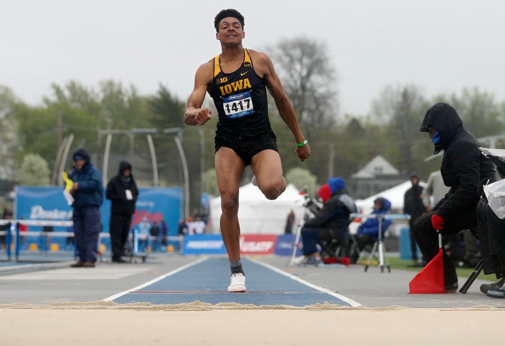 Iowa's James Carter jumps in the men's long jump event during the third day of the Drake Relays at Drake Stadium in Des Moines on Saturday, Apr. 27, 2019. (Stephen Mally/hawkeyesports.com)