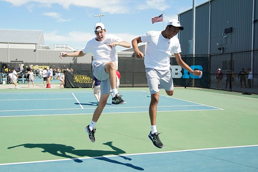 Iowa's Nakita Snezhko (from left) and Oliver Okonkwo celebrate after winning their match against Michigan at the Hawkeye Tennis and Recreation Complex in Iowa City on Sunday, Apr. 21, 2019. (Stephen Mally/hawkeyesports.com)