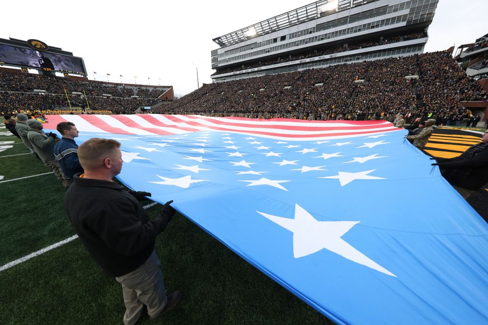 Veterans hold a large American flag before the Iowa Hawkeyes game against the Northwestern Wildcats Saturday, November 10, 2018 at Kinnick Stadium. (Brian Ray/hawkeyesports.com)
