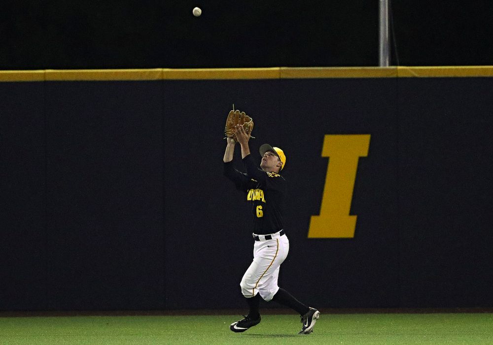 Iowa Hawkeyes center fielder Justin Jenkins (6) pulls in a fly ball for an out during the eighth inning of their game against Western Illinois at Duane Banks Field in Iowa City on Wednesday, May. 1, 2019. (Stephen Mally/hawkeyesports.com)