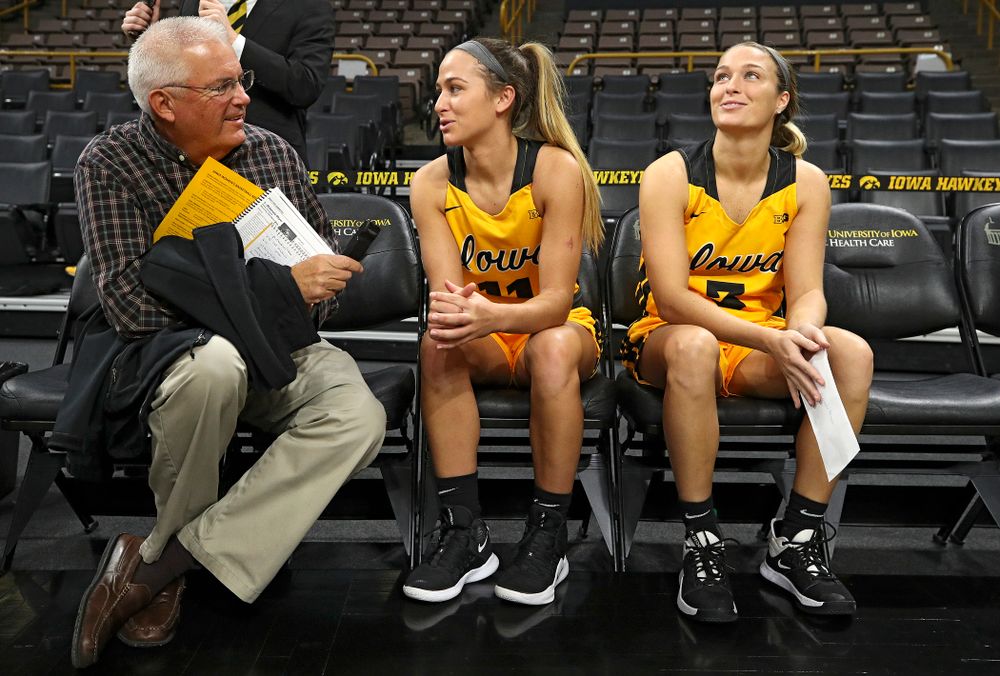 Iowa guard Megan Meyer (11) answers questions as her sister guard Makenzie Meyer (3) looks on during Iowa Women’s Basketball Media Day at Carver-Hawkeye Arena in Iowa City on Thursday, Oct 24, 2019. (Stephen Mally/hawkeyesports.com)