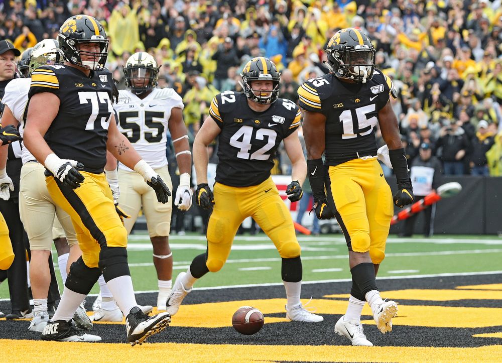 Iowa Hawkeyes running back Tyler Goodson (15) celebrates after scoring a touchdown during the third quarter of their game at Kinnick Stadium in Iowa City on Saturday, Oct 19, 2019. (Stephen Mally/hawkeyesports.com)