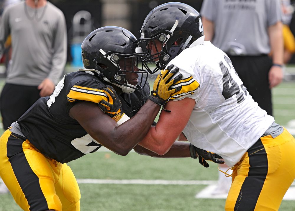 Iowa Hawkeyes running back Shadrick Byrd (from left) and linebacker Dillon Doyle (43) run a drill during Fall Camp Practice No. 10 at the Hansen Football Performance Center in Iowa City on Tuesday, Aug 13, 2019. (Stephen Mally/hawkeyesports.com)