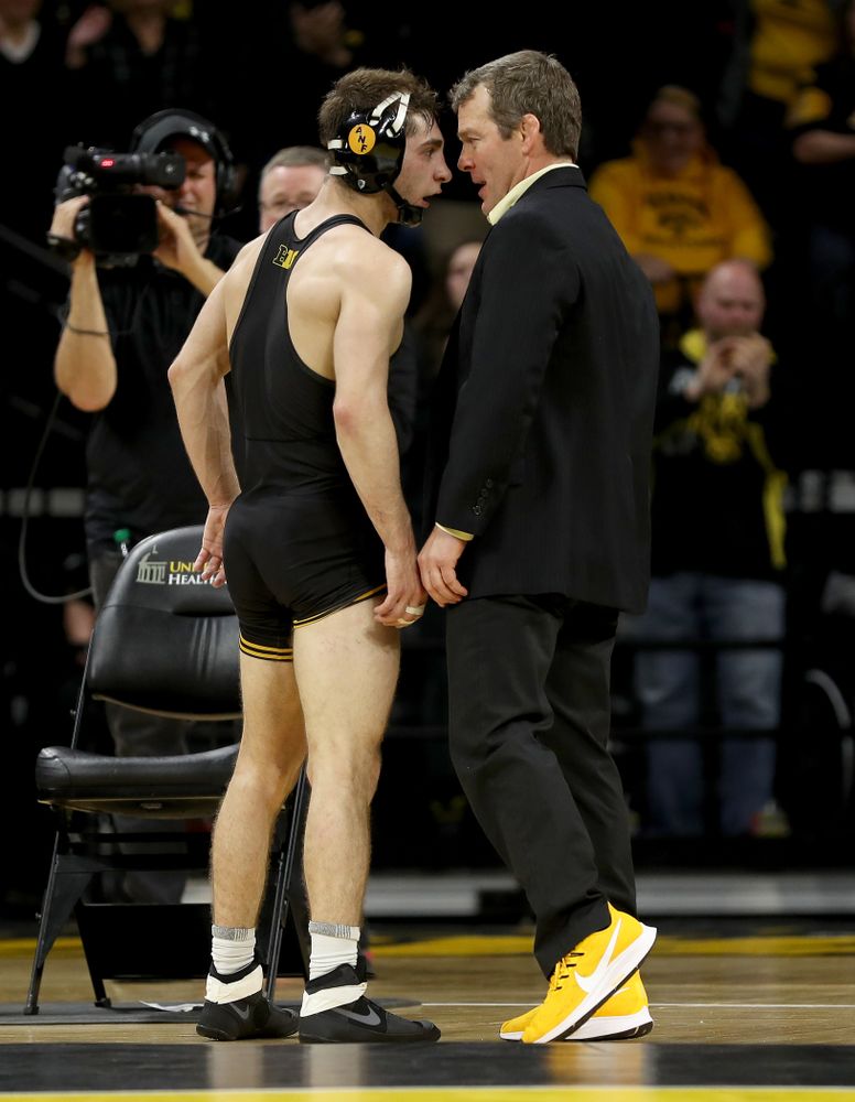 Iowa head coach Tom Brands celebrates with Austin DeSanto after his match against Ohio State’s Jordan Decatur at 133 pounds Friday, January 24, 2020 at Carver-Hawkeye Arena. DeSanto won the match with a 21-3 tech fall. (Brian Ray/hawkeyesports.com)